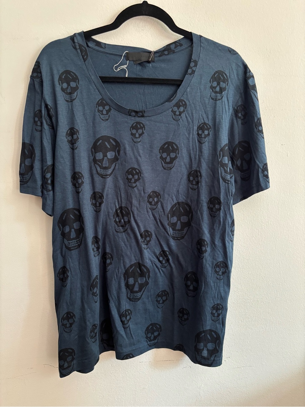 Alexander McQueen black skull print t-shirt on blue background